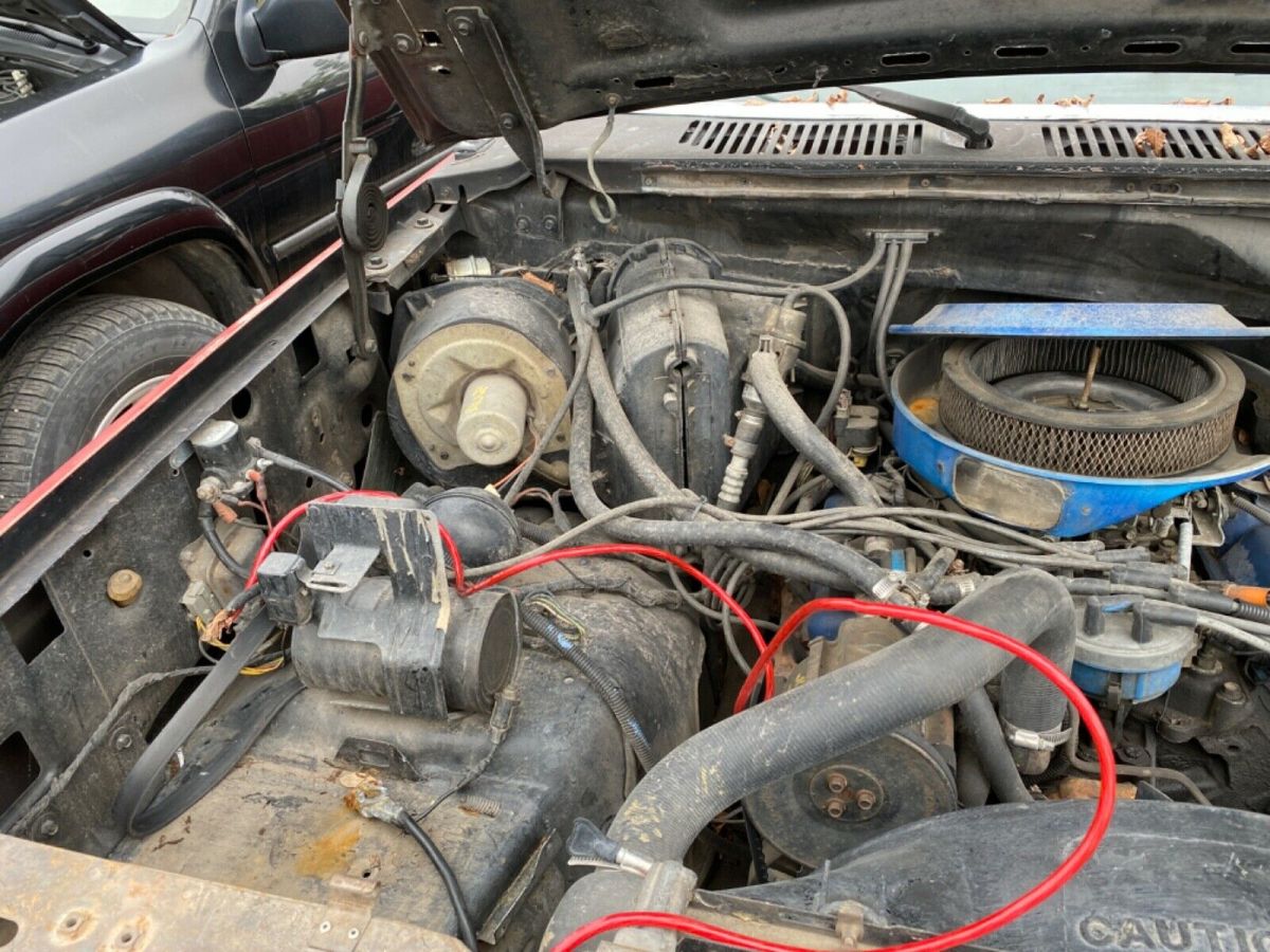1983 Red and Black Ford F-150 Extended Cab Pickup