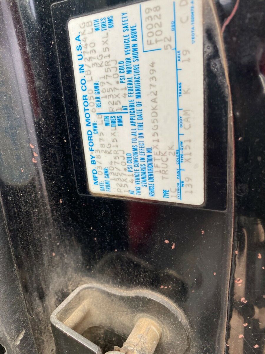 1983 Red and Black Ford F-150 Extended Cab Pickup