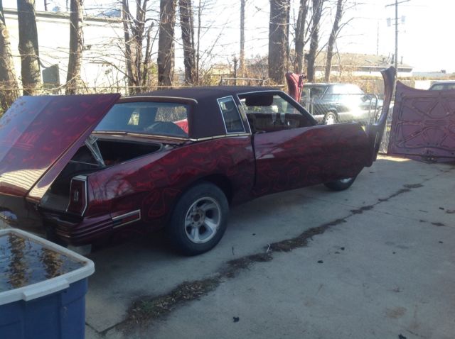 1983 Burgundy Pontiac Grand Prix Coupe