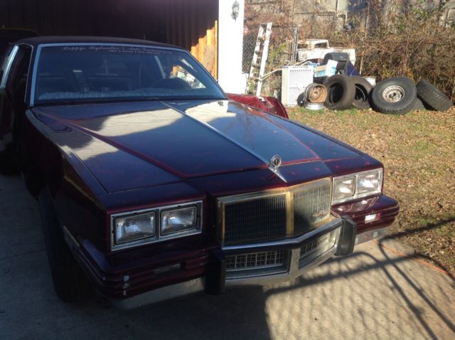 1983 Burgundy Pontiac Grand Prix Coupe