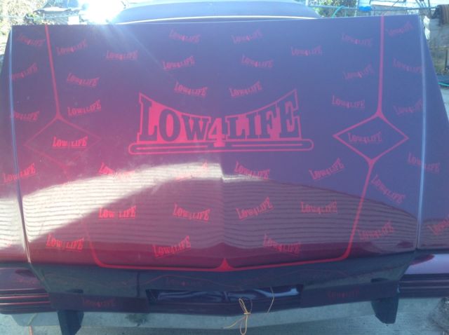 1983 Burgundy Pontiac Grand Prix Coupe