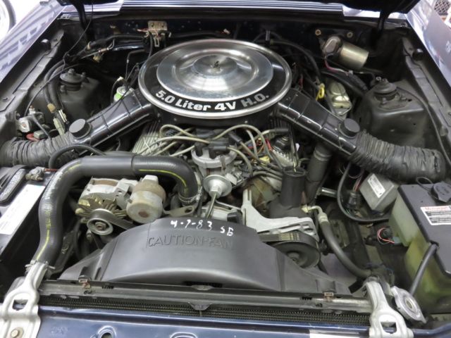 1983 blue Ford Mustang Convertible
