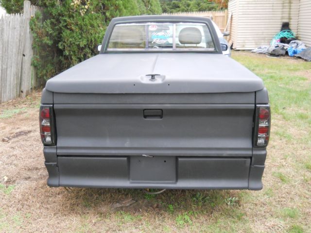 1984 black and gray Chevrolet S-10 reg. cab/ short bed