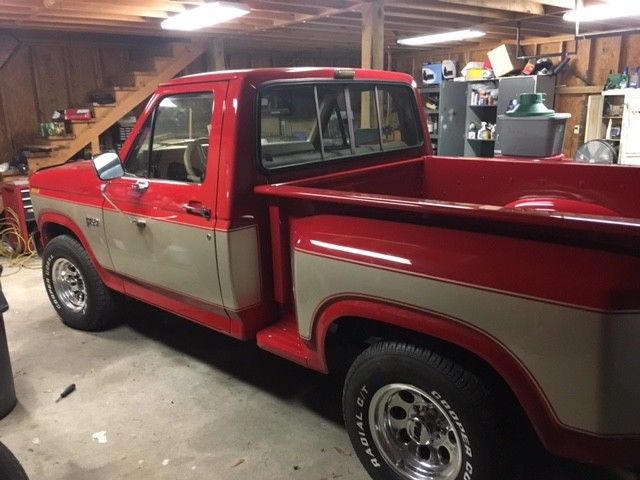 1984 red & silver Ford F-150 Standard Cab Pickup
