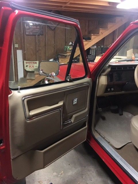 1984 red & silver Ford F-150 Standard Cab Pickup