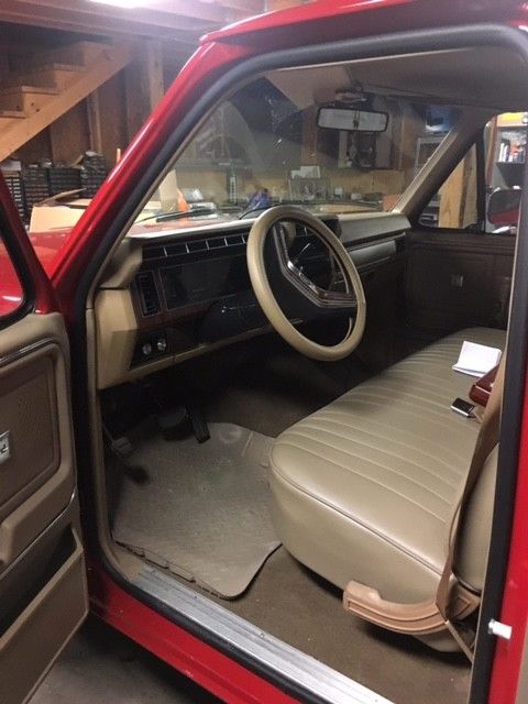 1984 red & silver Ford F-150 Standard Cab Pickup