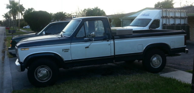 1984 blue and white Ford F-250 Pick-up