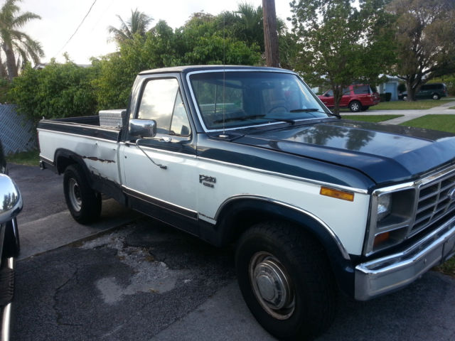 1984 blue and white Ford F-250 Pick-up
