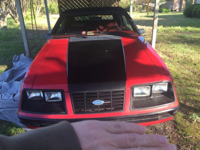 1984 red Ford Mustang Convertible