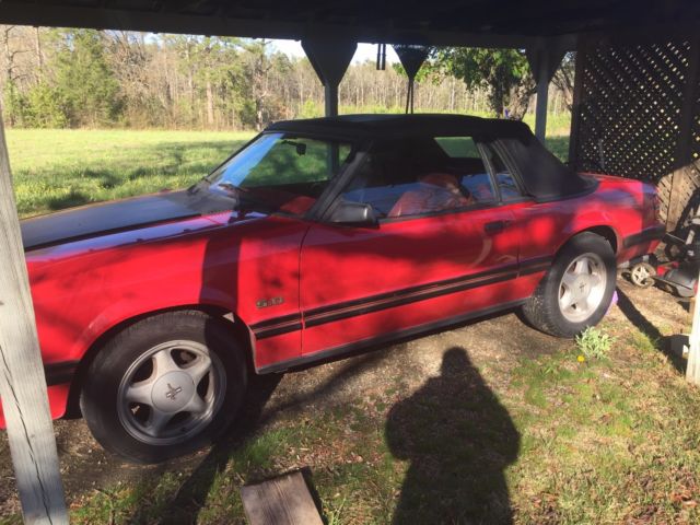 1984 red Ford Mustang Convertible