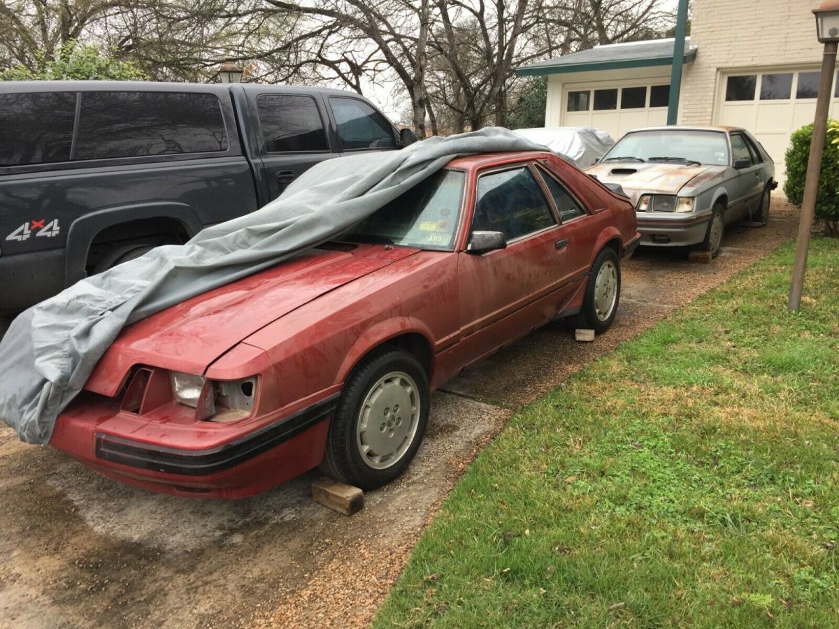 1984 Burgundy Ford Mustang Hatchback