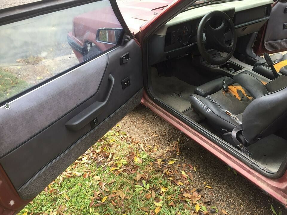 1984 Burgundy Ford Mustang Hatchback