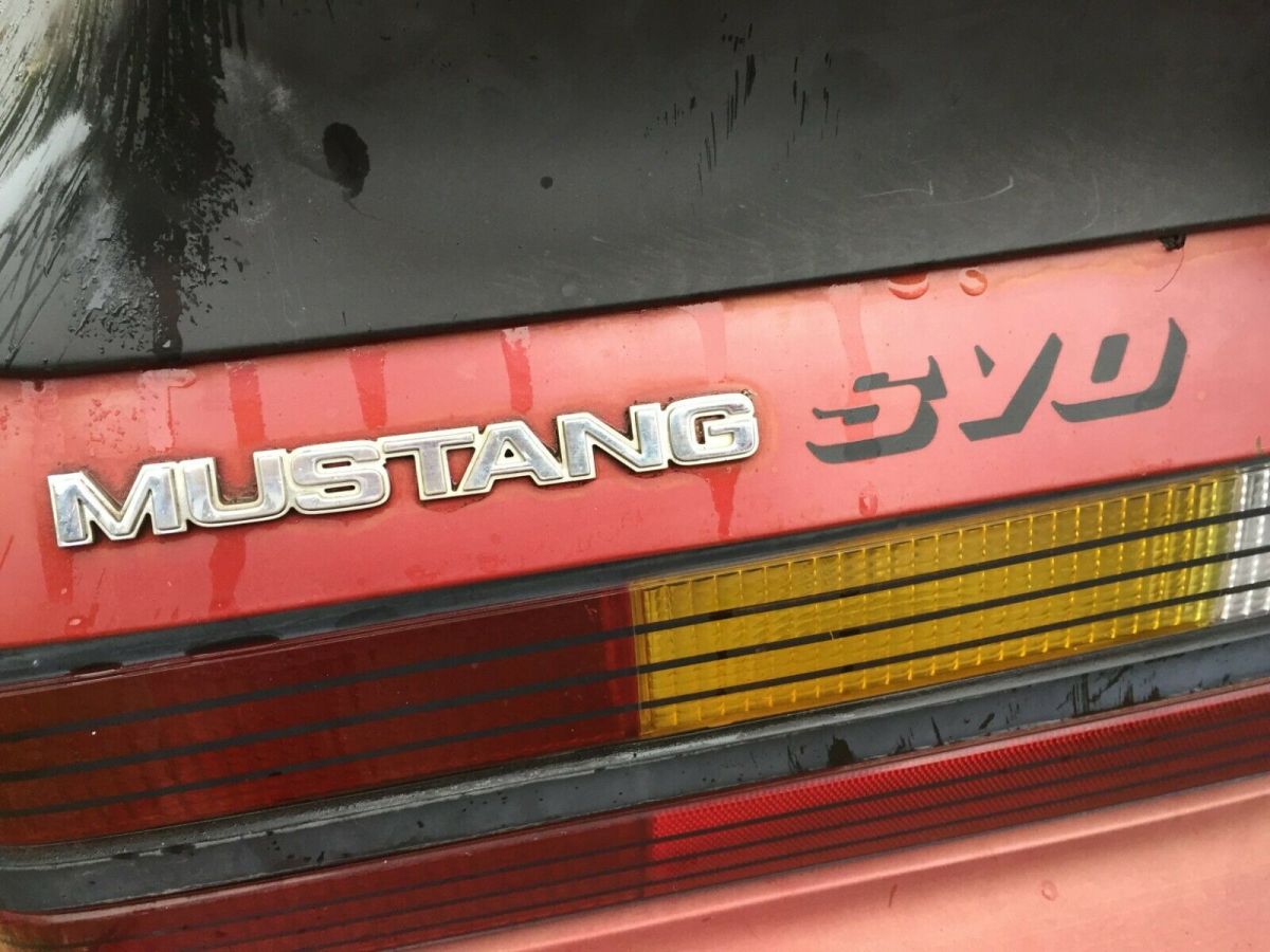 1984 Burgundy Ford Mustang Hatchback