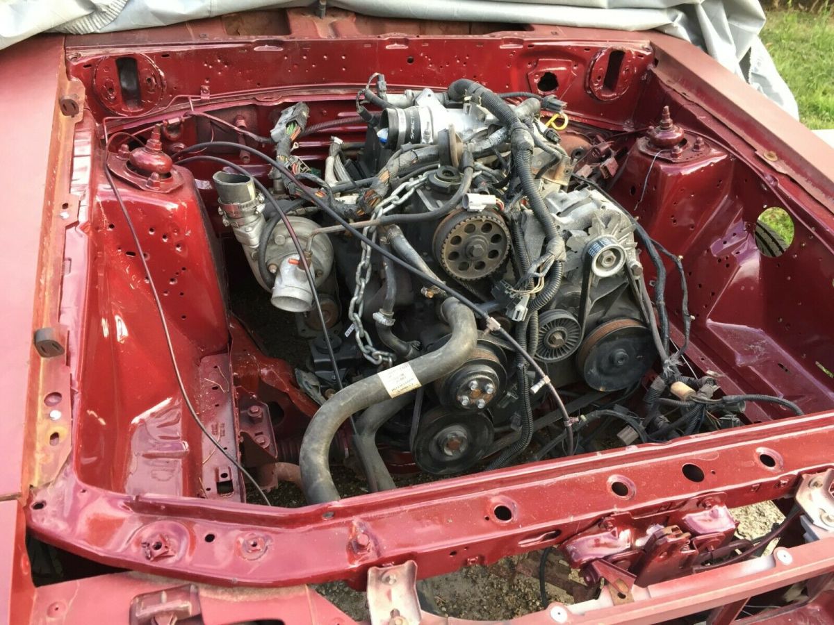 1984 Burgundy Ford Mustang Hatchback