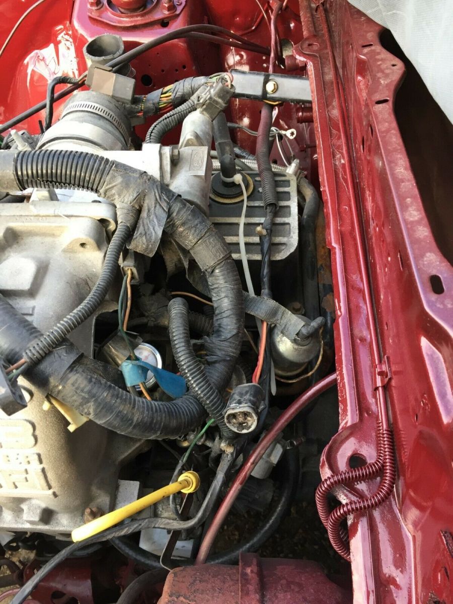 1984 Burgundy Ford Mustang Hatchback