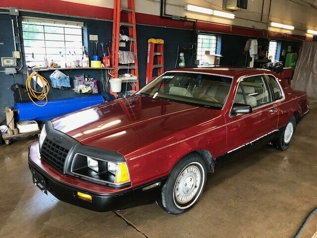 1984 Red Ford Thunderbird Sedan