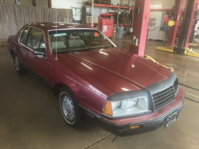 1984 Red Ford Thunderbird Sedan