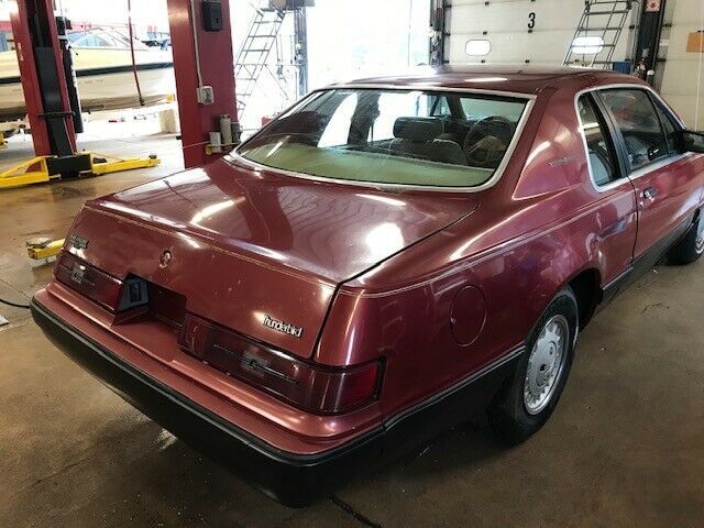 1984 Red Ford Thunderbird Sedan
