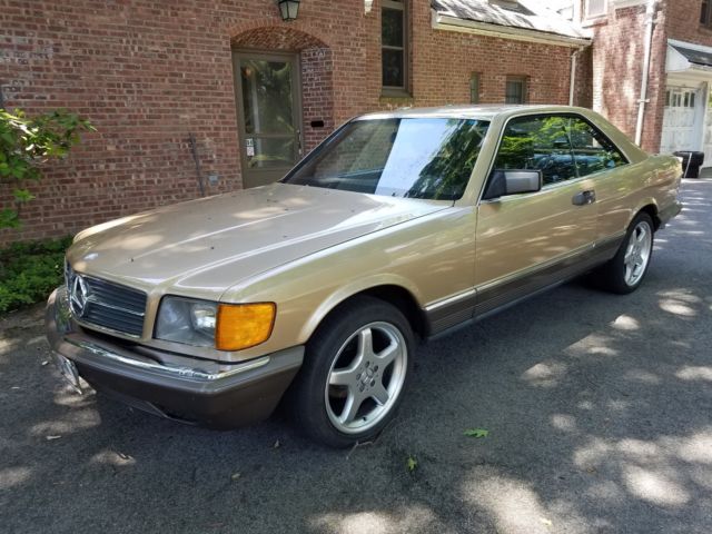 1984 Gold Mercedes-Benz 500-Series Coupe