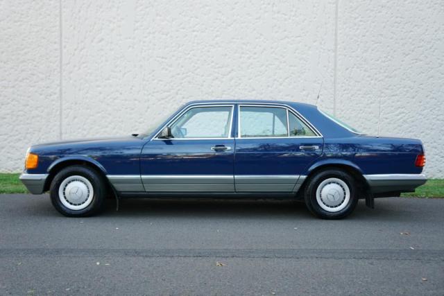1984 Blue Mercedes-Benz 200-Series Sedan