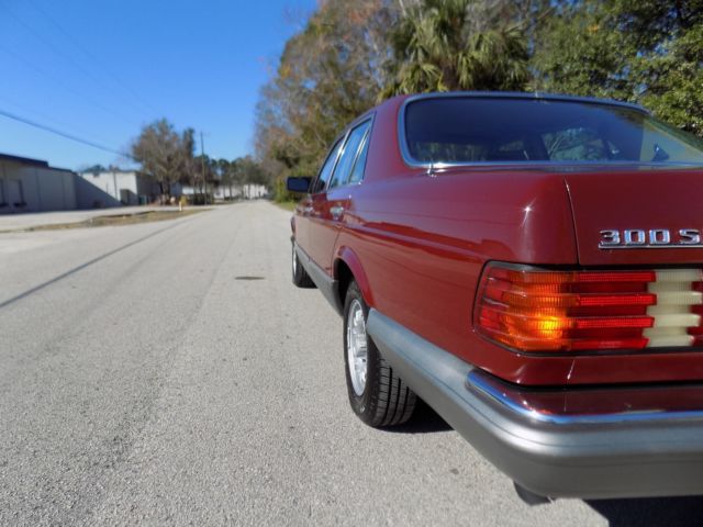 1984 Orient red Mercedes-Benz 300-Series sedan