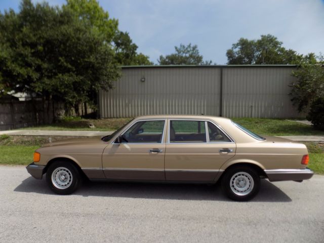 1984 champagne pearl Mercedes-Benz 500-Series sedan