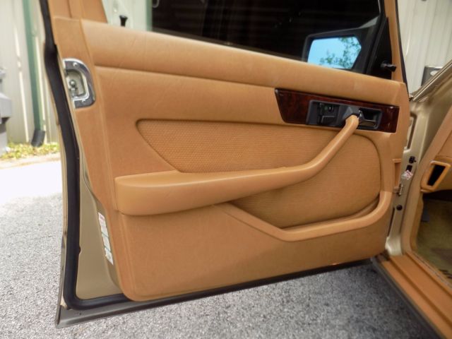 1984 champagne pearl Mercedes-Benz 500-Series sedan