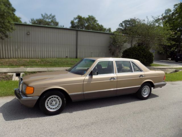 1984 champagne pearl Mercedes-Benz 500-Series sedan