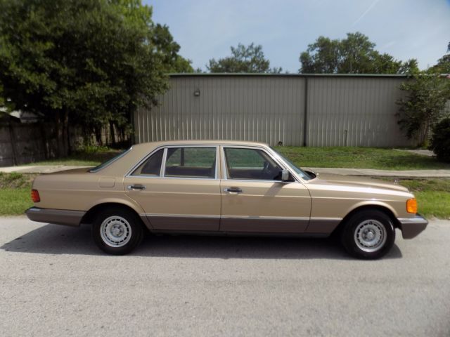 1984 champagne pearl Mercedes-Benz 500-Series sedan