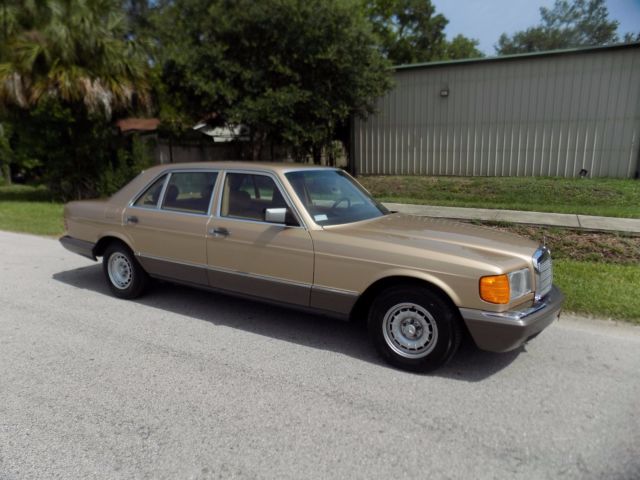 1984 champagne pearl Mercedes-Benz 500-Series sedan
