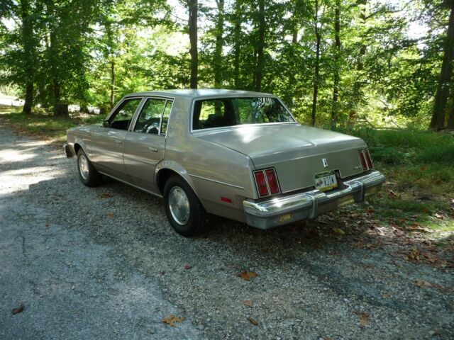 1984 Beige Oldsmobile Cutlass Sedan