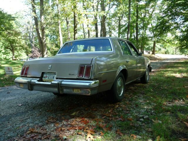 1984 Beige Oldsmobile Cutlass Sedan