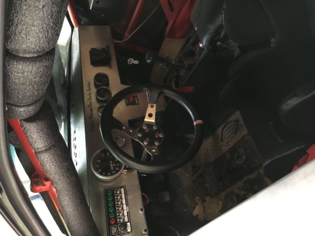 1984 white blue Pontiac Fiero Coupe