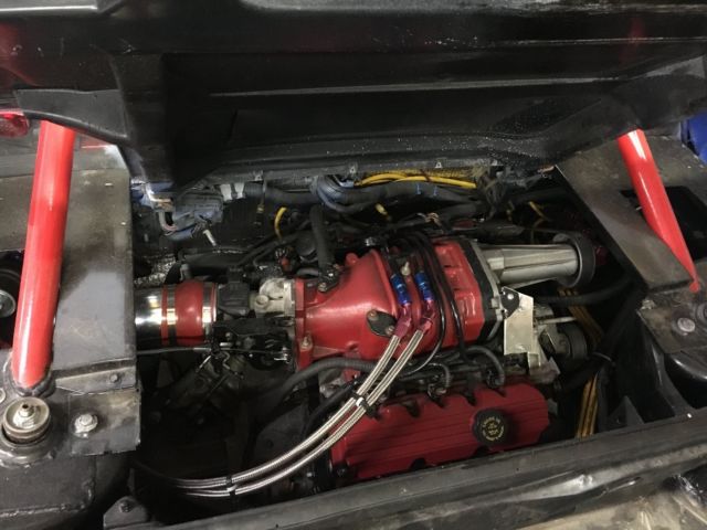 1984 white blue Pontiac Fiero Coupe