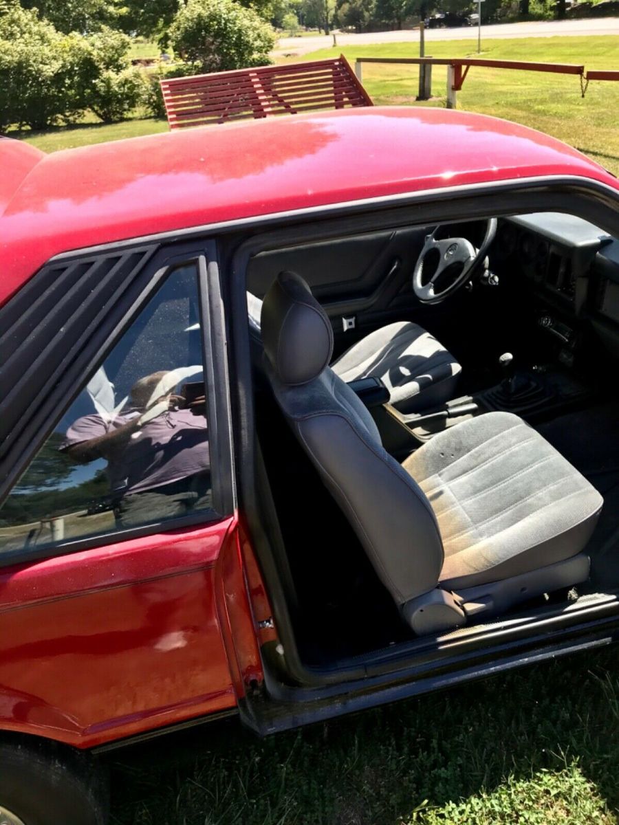 1984 Red Ford Mustang 2 dr sedan hatchback