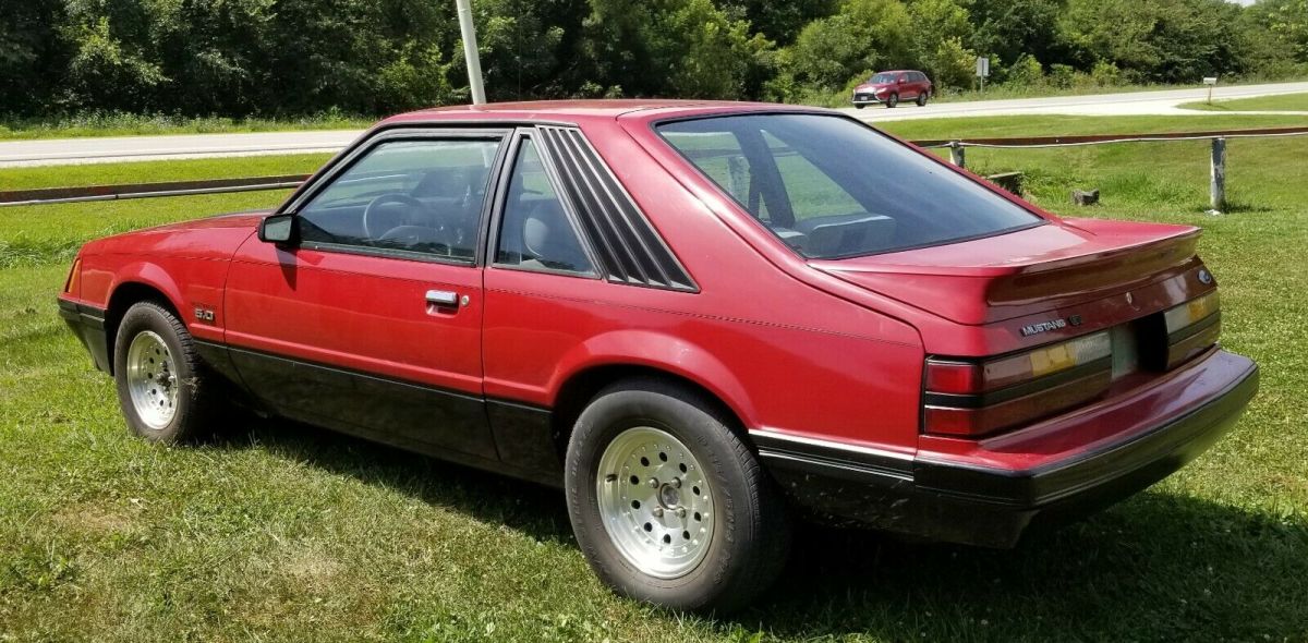 1984 Red Ford Mustang 2 dr sedan hatchback