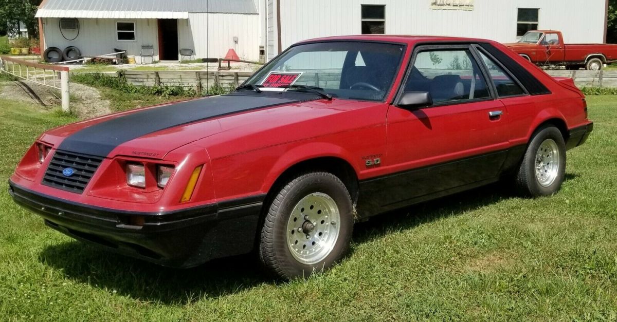 1984 Red Ford Mustang 2 dr sedan hatchback