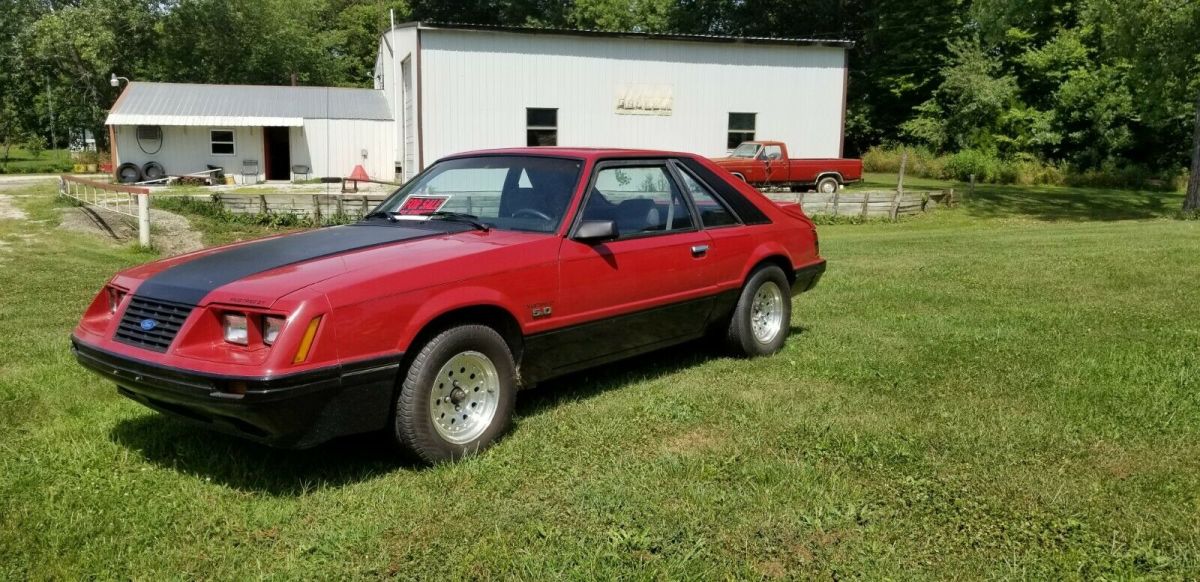1984 Red Ford Mustang 2 dr sedan hatchback