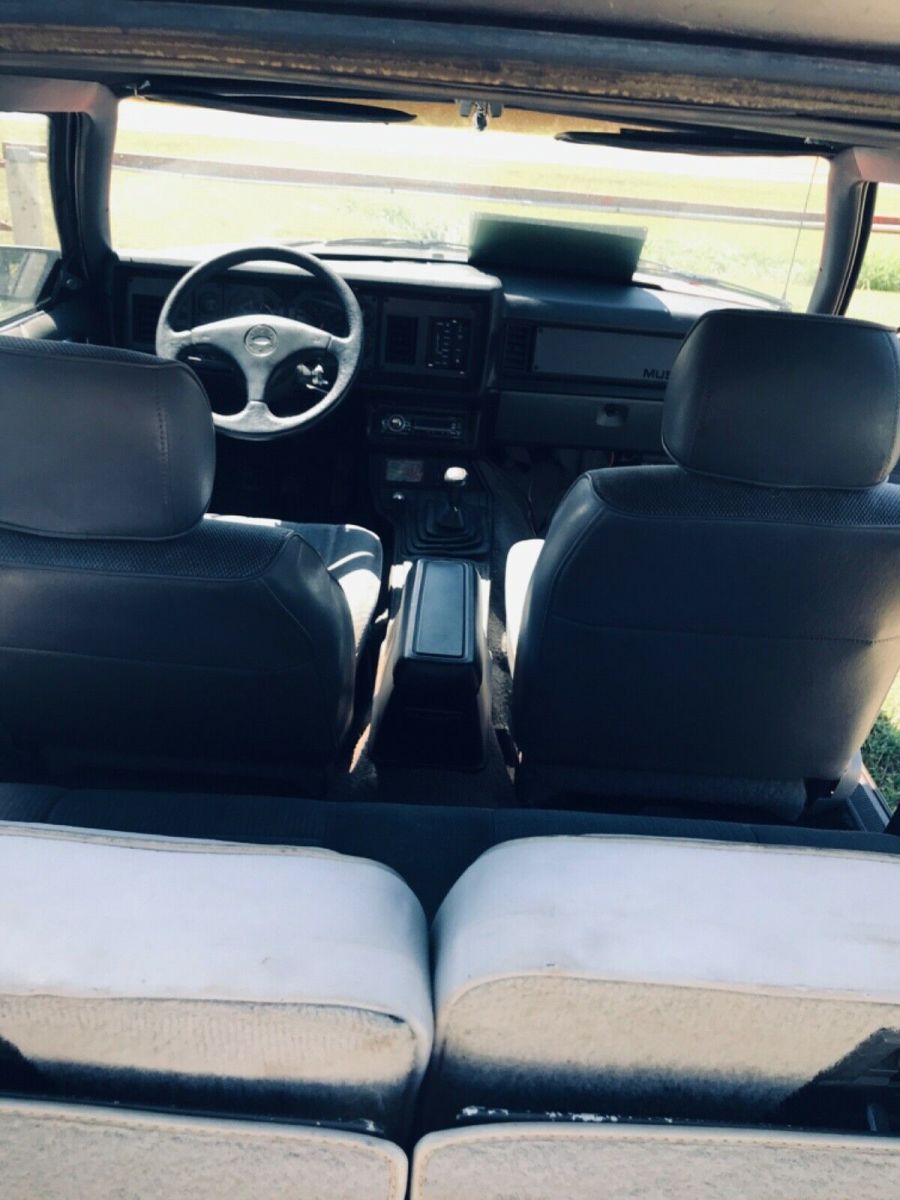 1984 Red Ford Mustang 2 dr sedan hatchback