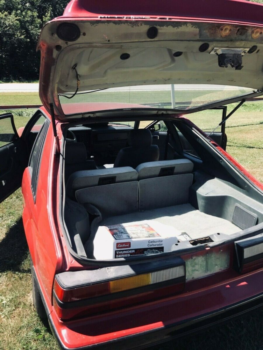 1984 Red Ford Mustang 2 dr sedan hatchback