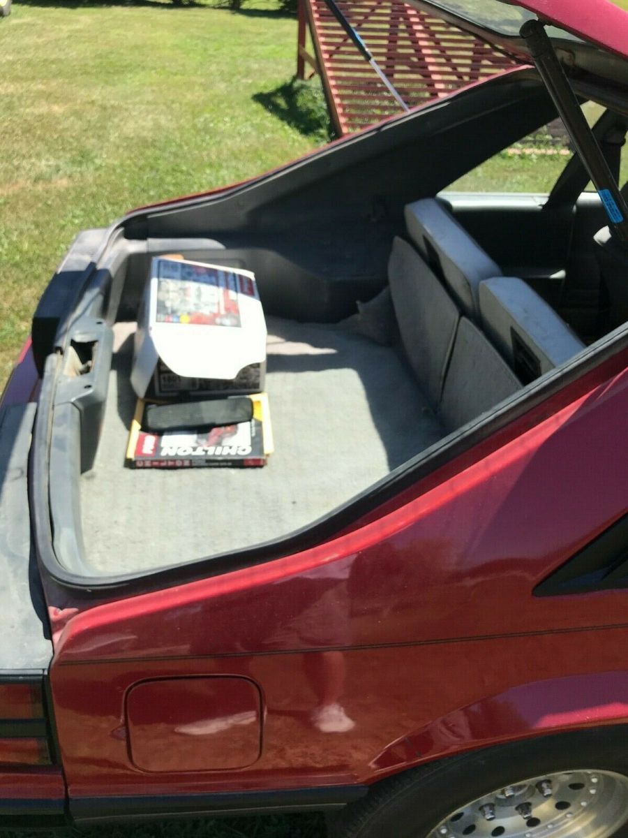 1984 Red Ford Mustang 2 dr sedan hatchback