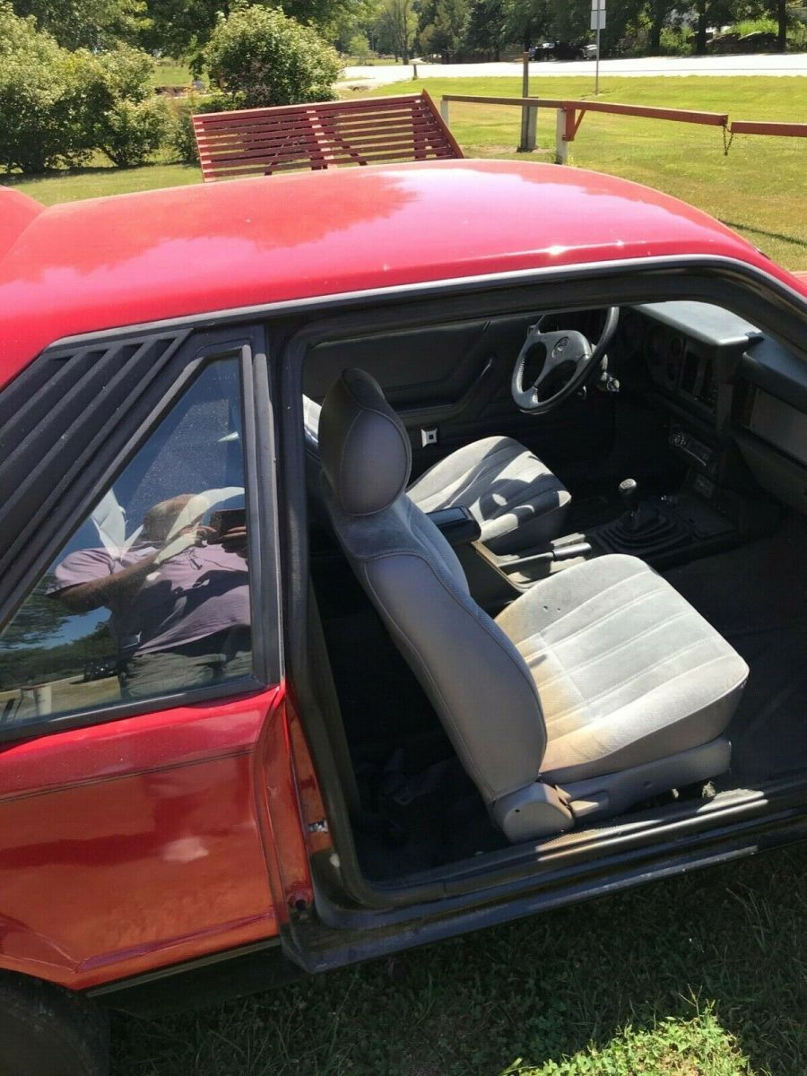 1984 Red Ford Mustang 2 dr sedan hatchback