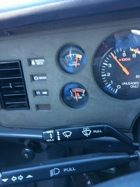 1985 red Ford Mustang Hatchback