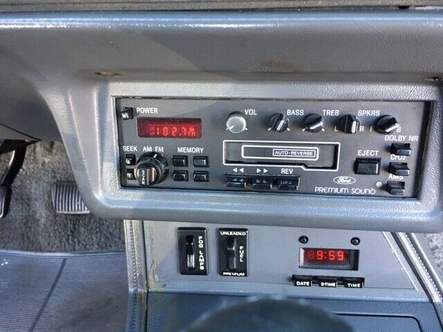 1985 red Ford Mustang Hatchback