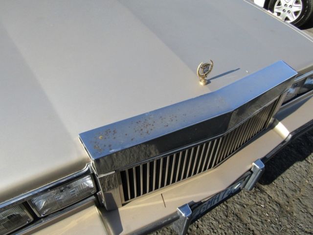 1985 Gold Cadillac Fleetwood