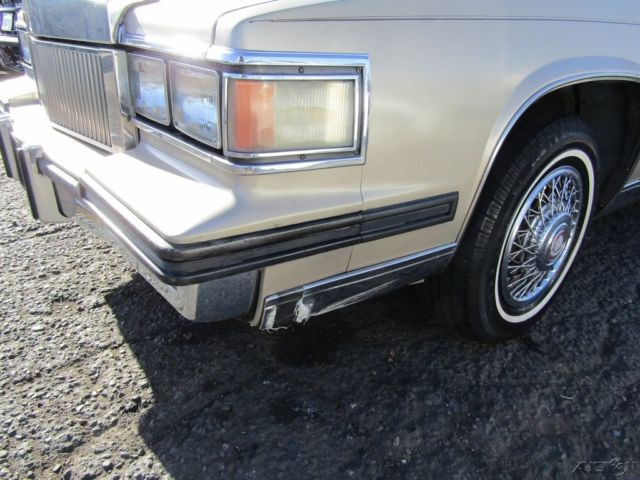 1985 Gold Cadillac Fleetwood