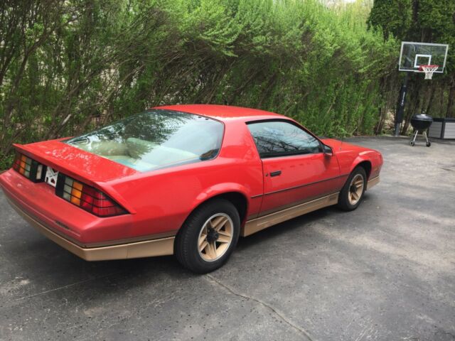 1985 Red with gold Chevrolet Camaro Coupe