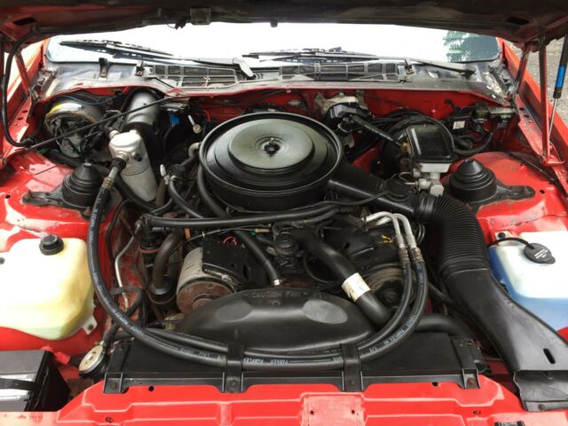1985 Red with gold Chevrolet Camaro Coupe