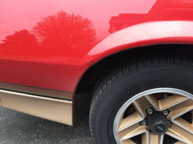 1985 Red with gold Chevrolet Camaro Coupe