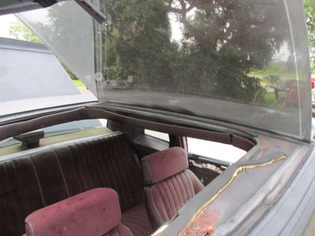 1986 maroon Chevrolet SS T-Top